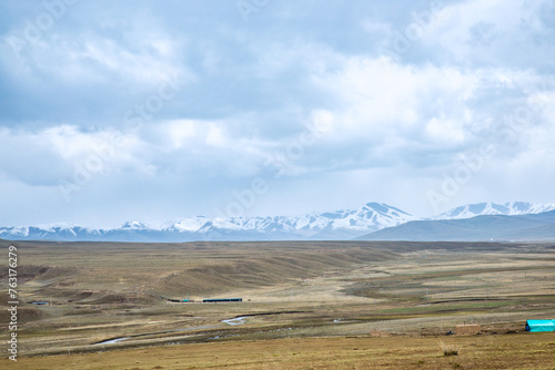 Ganjia Secret Land  Gannan Tibetan Autonomous Prefecture  Gansu Province-the grassland under the snow-capped mountains