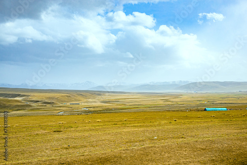 Ganjia Secret Land, Gannan Tibetan Autonomous Prefecture, Gansu Province-the grassland under the snow-capped mountains photo