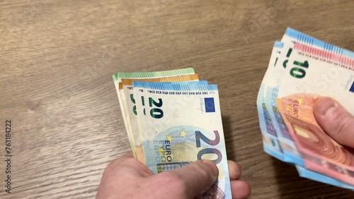 EURO coins notes count. EURO Money cash in hand. EURO Money Banknotes for pay. EURO bills and coins in Crisis of European Union. Counting the saved Coins bills for pension. Hands counting money.