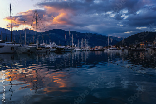 Boats, motorboats and yachts in the port at sunset in Tivat, Porto Monetengro, sea travel and adventures