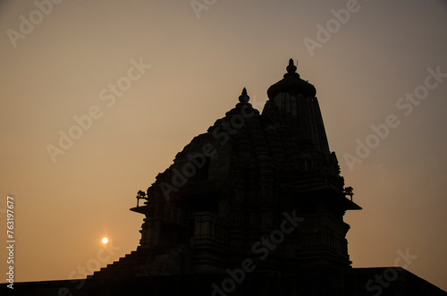 Silhouette of Vamana temple during Sunset, Khajuraho, Madhya Pradesh, India, Asia.  photo