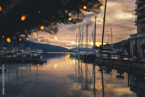 Boats, motorboats and yachts in the port at sunset in Tivat, Porto Monetengro, sea travel and adventures