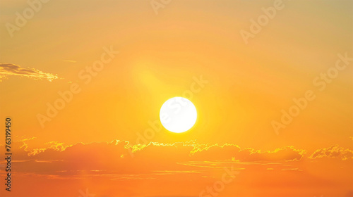 photo of the sun setting in an orange sky