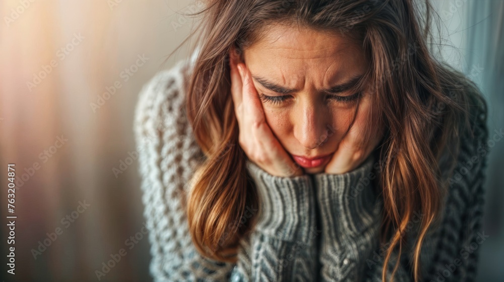 Close-up portrait of a young woman suffering from severe depression.