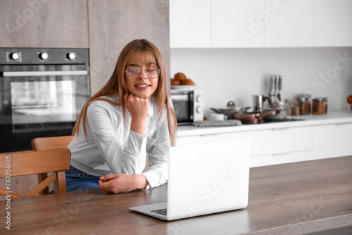 Teenage girl with laptop vi...