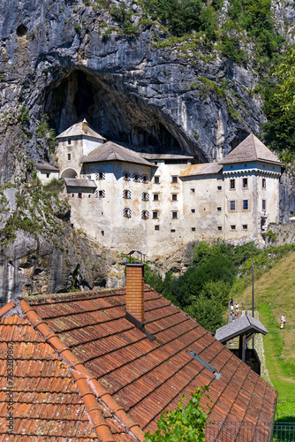Beautiful impressive medieval castle with cave in the background at Slovenian village of Predjama on a sunny summer day. Photo taken August 11th  2023  Predjama  Slovenia.