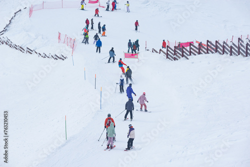 People on the ski on the winter resort.