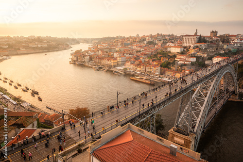 Aerial view of Porto with Luis I Bridge and Douro River at sunset. High quality stock photo