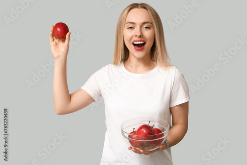 Young woman with apples on ...