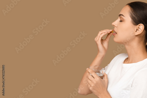 Pretty young woman taking v...
