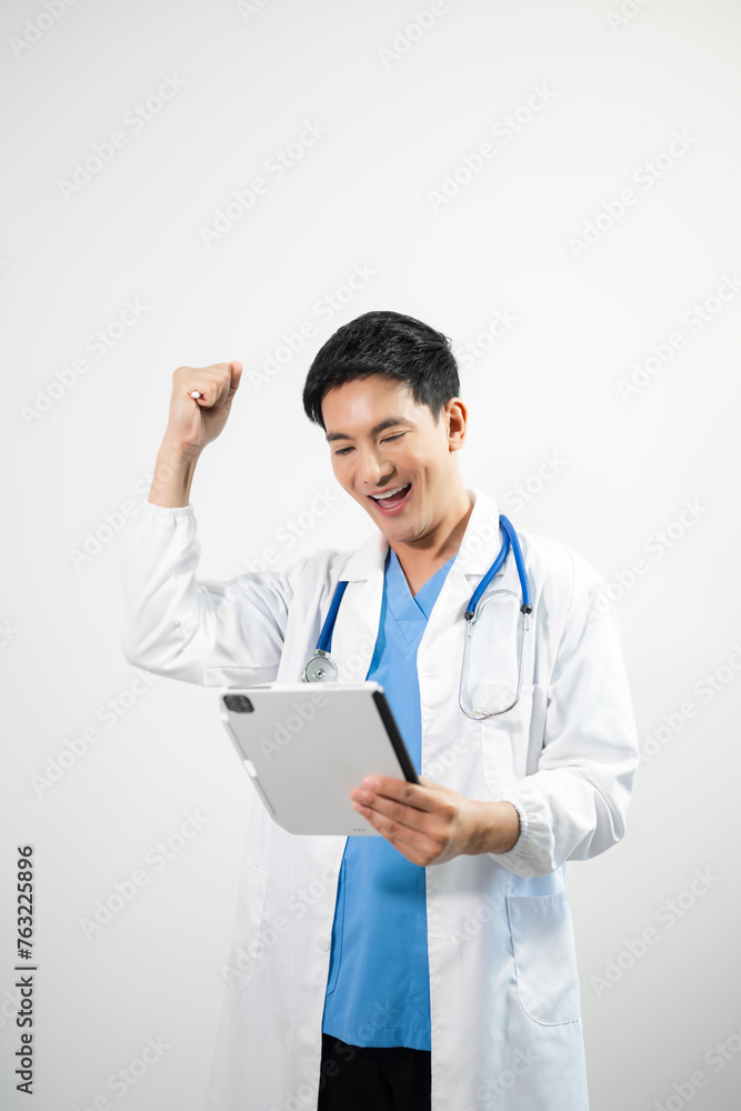 Man portrait of a doctor wearing a white coat and a stethoscope looking into the camera on a white isolated background Man portrait of a doctor wearing a white coat and a stethoscope looking into the camera on a white isolated background