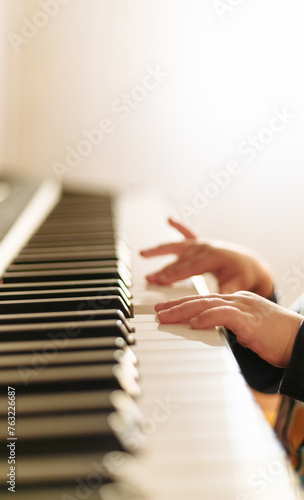 little hand of baby play piano