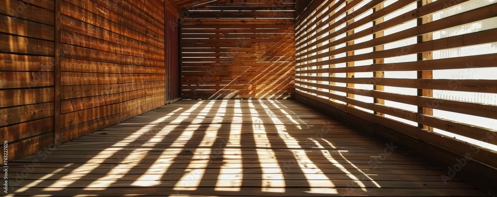 Sunlight casting shadows in a wooden corridor