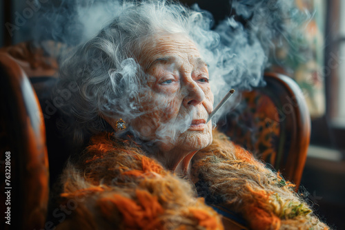 old elderly sad woman smokes a joint of marijuana cigarette