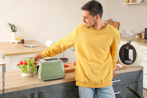 Young man with modern toast...