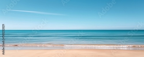 Serene beach with clear sky