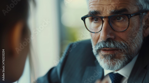 A moment of understanding  businessman with glasses in a pivotal face-to-face conversation.