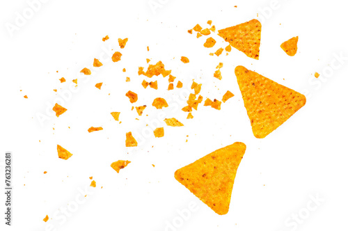 Bild auf Leinwand Pile tortilla chips crumbs, yellow pieces flying isolated on white background