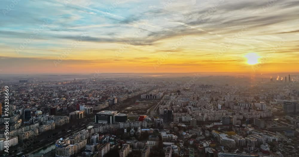 Aerial drone view of Bucharest city at sunset. Moving traffic. Romania Aerial drone view of Bucharest city at sunset. Moving traffic. Romania