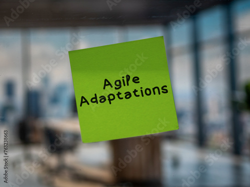 Post note on glass with 'Agile Adaptations'. photo