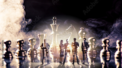 double exposure of chess piece on chess board game with silhouette business team and strategy, business success concept, business competition planning teamwork strategic concept.	 photo