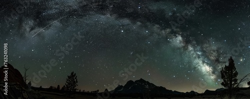Milky way over mountain landscape at night