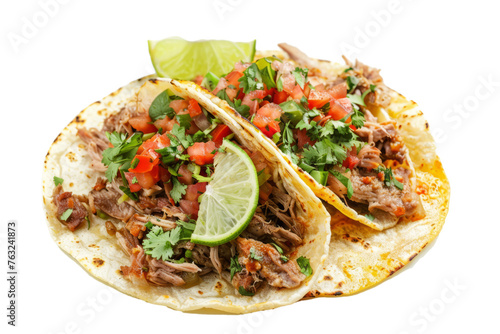 top view of carnitas tacos, featuring slow-cooked pork, salsa, cilantro, and lime wedges, served on corn tortillas.