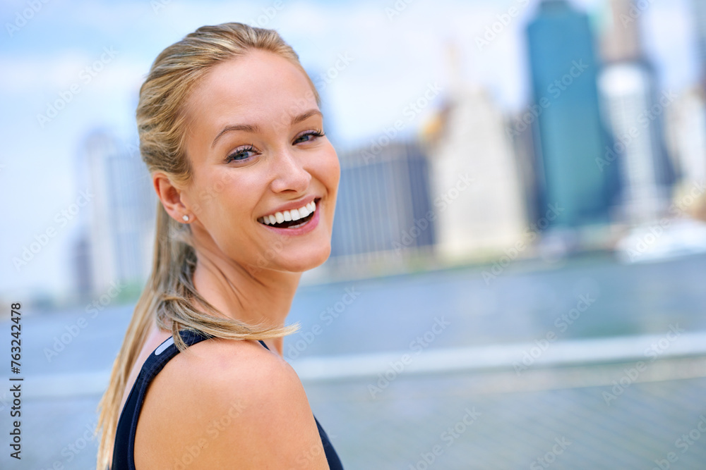 Woman, fitness and portrait by river in city for morning routine, wellness and exercise for active cardio. Female person, happy and runner or athlete for sports hobby or training workout in New York.
