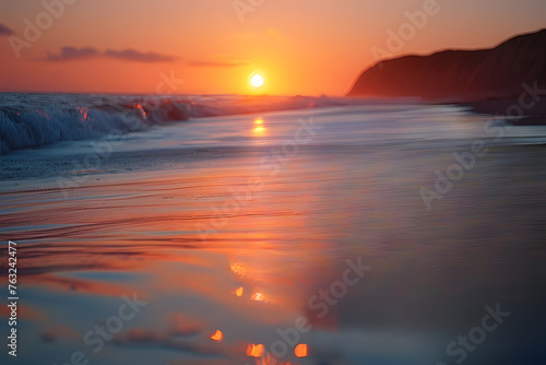 Golden sunset with waves on sandy shore