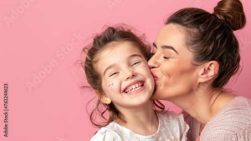 Woman Kissing Little Girl Cheek