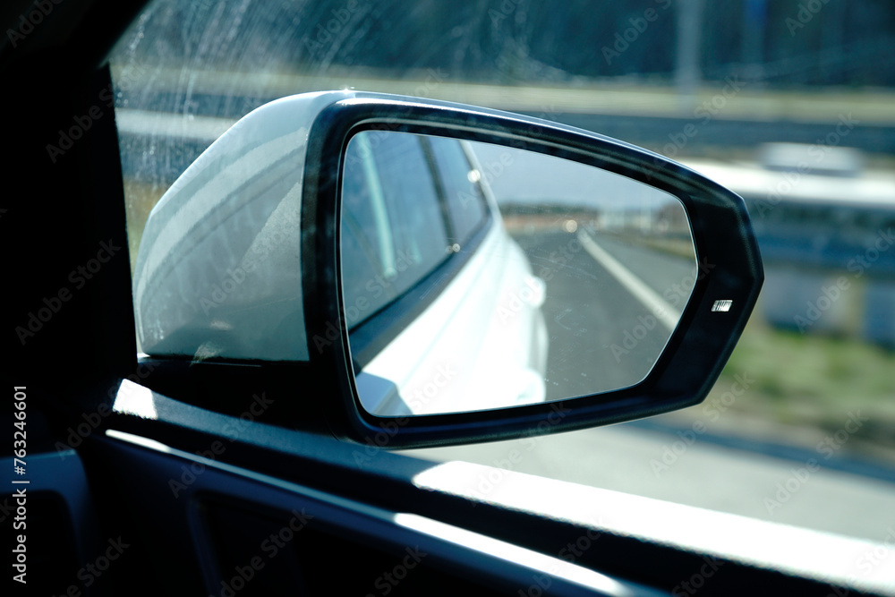 Car side mirror and defocused background