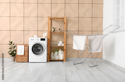 Interior of room with laundry basket, washing machine and dryer © Pixel-Shot