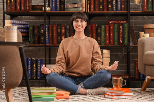 Young woman with books medi...