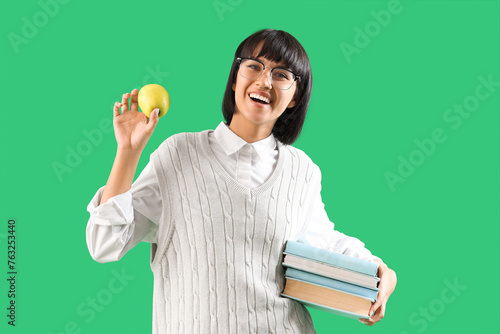 Young woman with books and ...