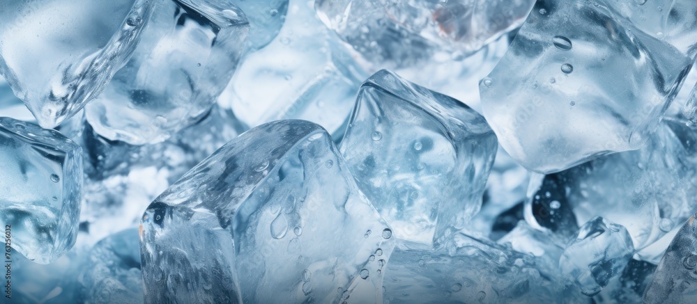 A close up of a stack of ice cubes on a table, glistening with an electric blue hue. The frozen water displays a mesmerizing pattern resembling snowflakes, with a touch of frost on the surface
