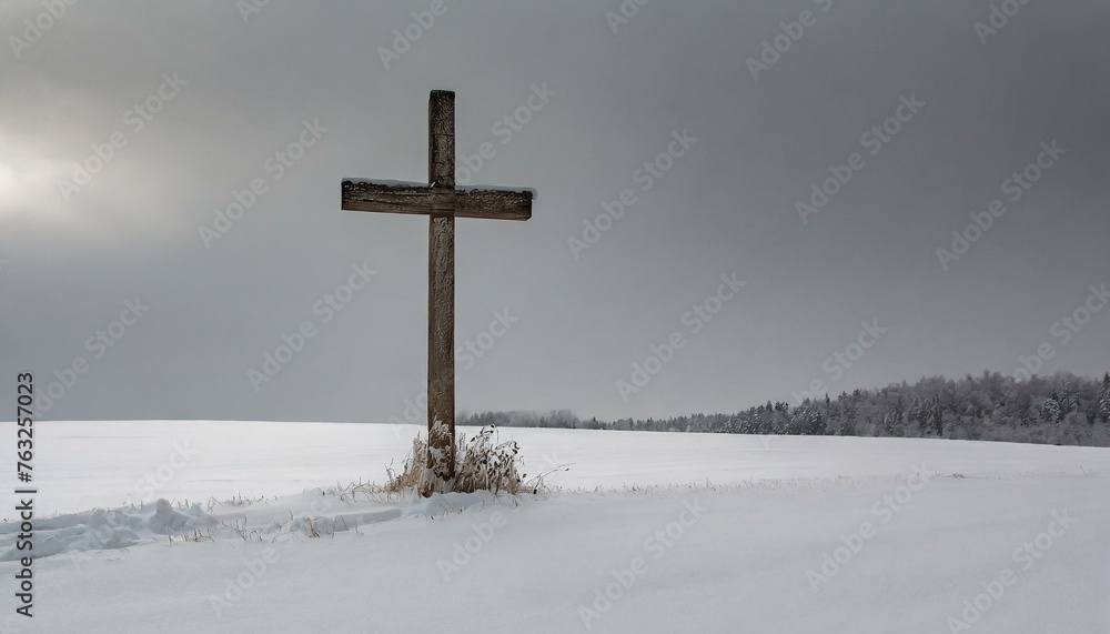 Wooden Cross in a Snowy Meadow in the Winter Wooden Cross in a Snowy Meadow in the Winter