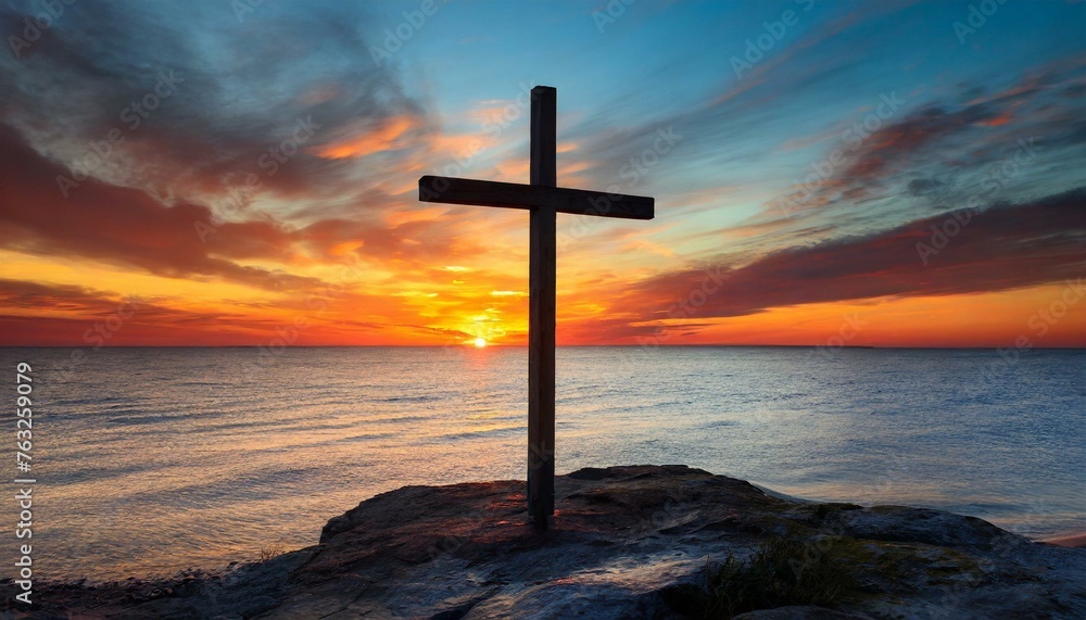 Wooden Cross against Sunset by the Sea