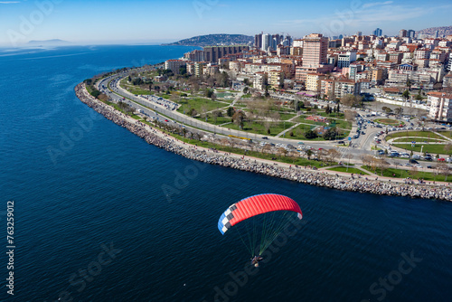 Aerial view of paramotor flying near park in Maltepe district on the Marmara Sea coast of the Asian side of Istanbul, Turkey.