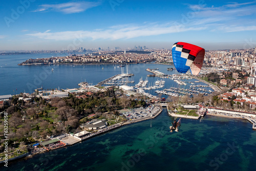 Aerial view of paramotor flying near Kalamis Marina on the Marmara Sea coast of the Asian side of Istanbul, Turkey. photo
