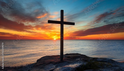 Wooden Cross against Sunset by the Sea