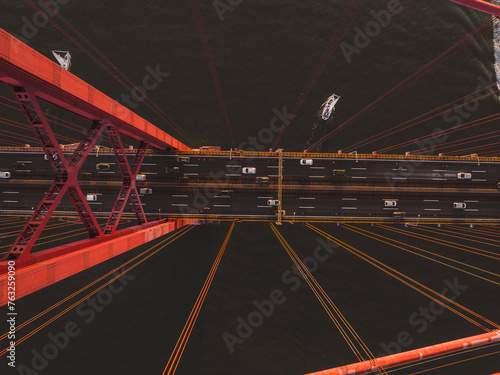 Aerial view of cars crossing the April 25th bridge across the Tagus river in Lisbon, Portugal . photo