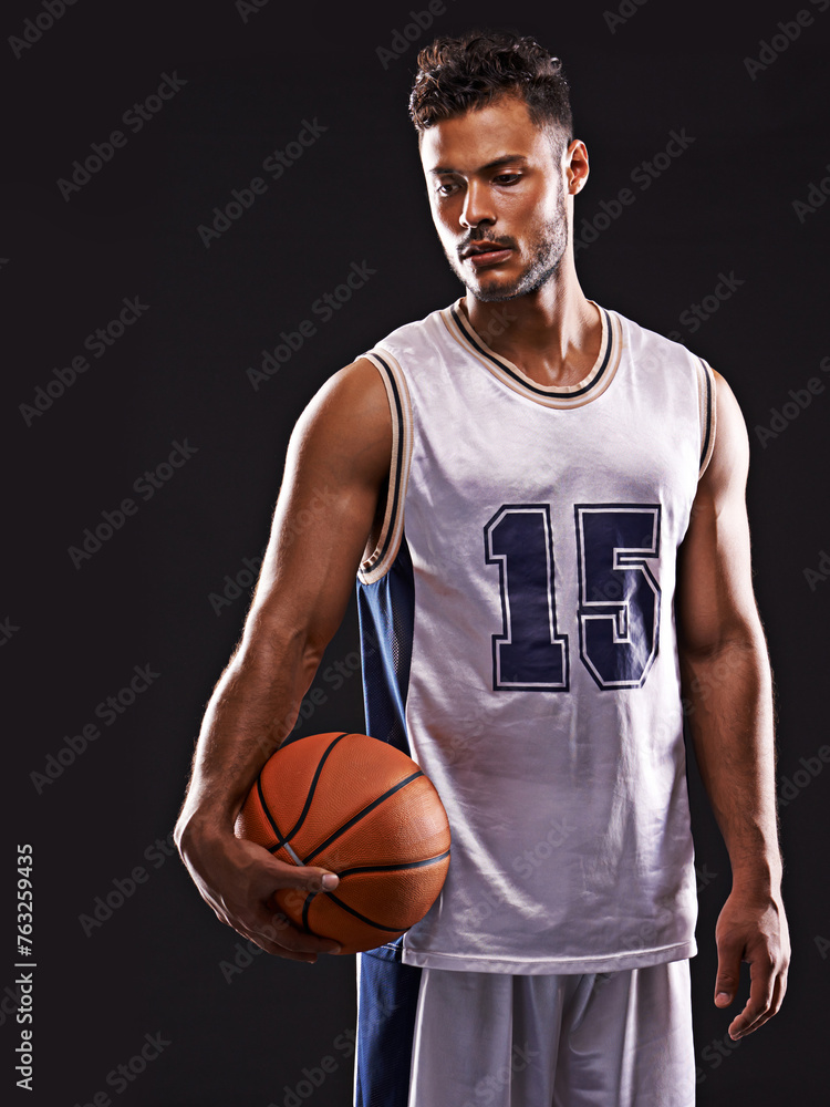 Man, action and basketball player in studio for fitness, competition and training on black background. Professional athlete, career and exercise with ball for game, hobby and healthy model in sport Man, action and basketball player in studio for fitness, competition and training on black background. Professional athlete, career and exercise with ball for game, hobby and healthy model in sport