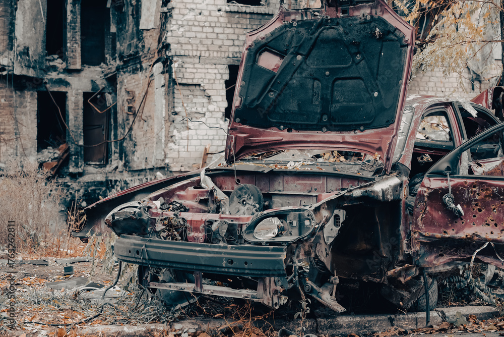 damaged and looted cars in a city in Ukraine during the war