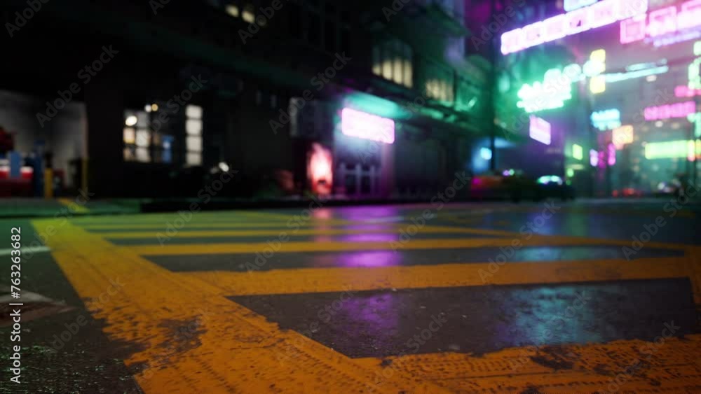 A bustling city street illuminated by vibrant traffic lights at night ...