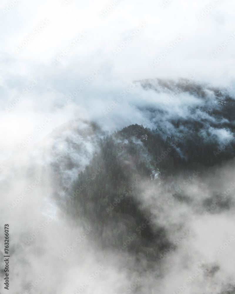 Aerial view of Molveno lake in the misty Dolomites, Trentino, Italy. Aerial view of Molveno lake in the misty Dolomites, Trentino, Italy.