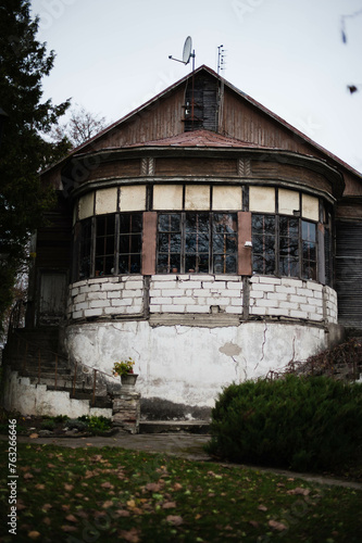 An ancient, round, two-story tower stands tall, exuding timeless charm and history, evoking a sense of mystery and allure photo