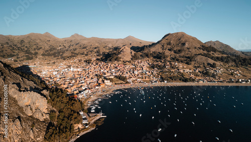 Aerial drone view at sunset of the town of Copacabana along Lake Titicaca coast, Bolivia. photo