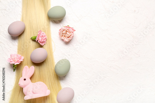Hair strand with flowers  Easter eggs and bunny on white grunge background