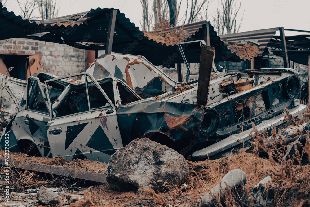 Fototapeta premium damaged and looted cars in a city in Ukraine during the war