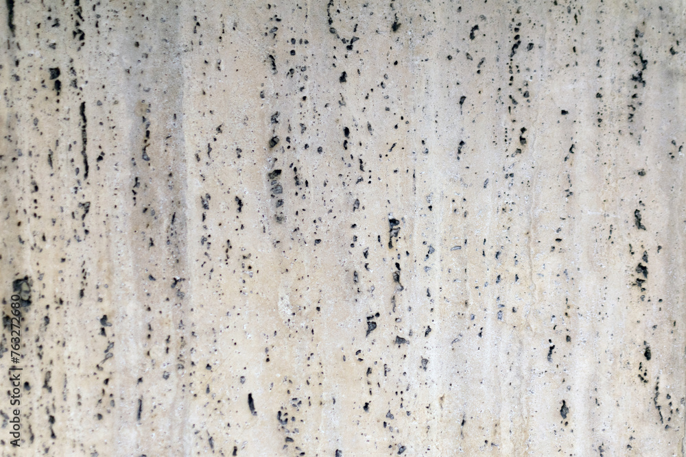 Gray granite wall, with holes, rough rough surface, construction work, interior design, natural stone